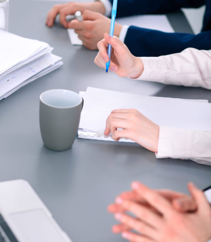 Group of business people working together in office.